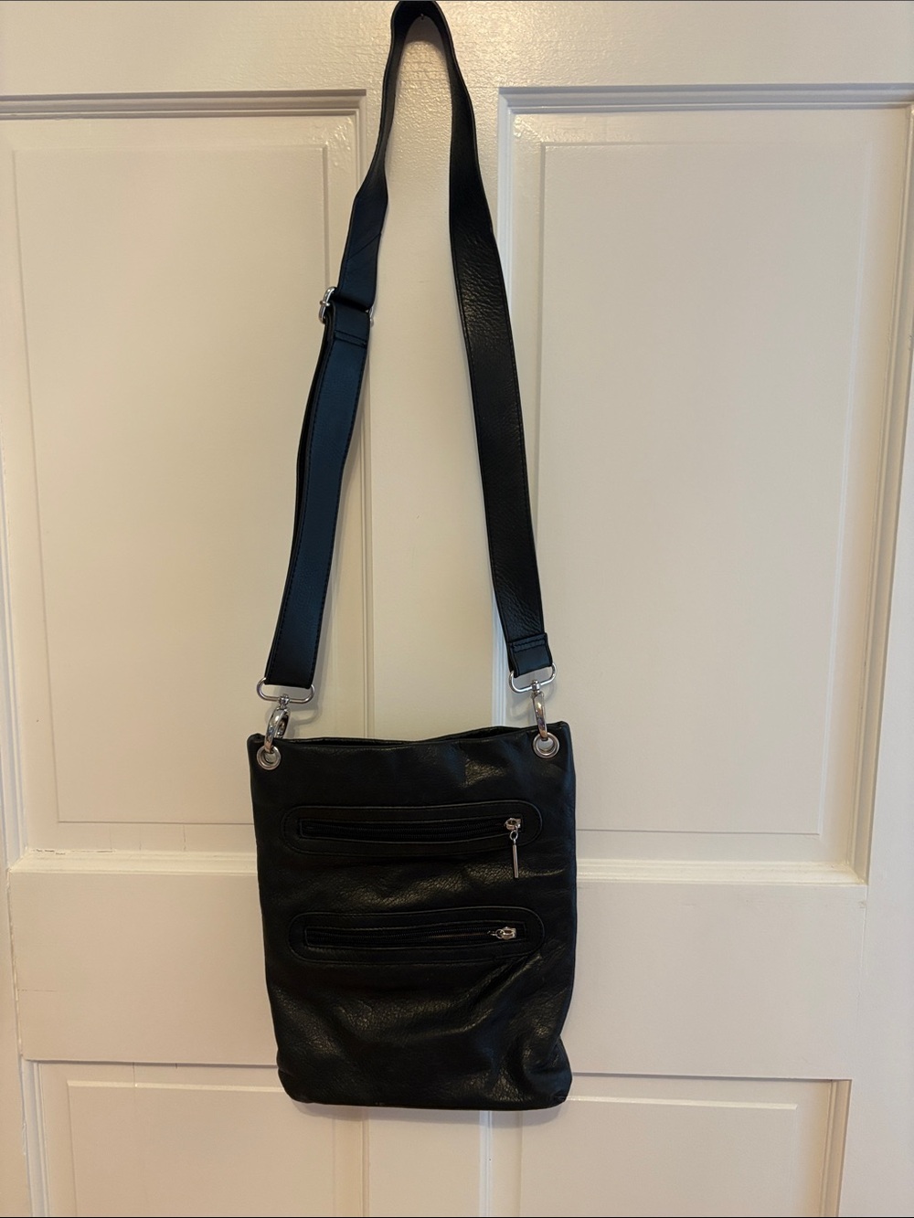 Black Leather Messenger Bag with Adjustable Strap and multiple pockets